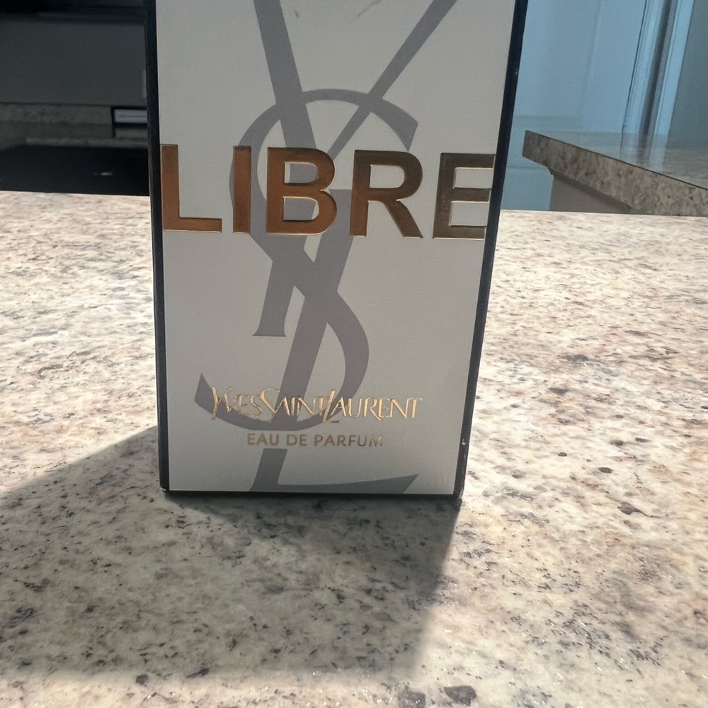 Yves Saint Laurent Libre Perfume with Gold and Gray Accents
